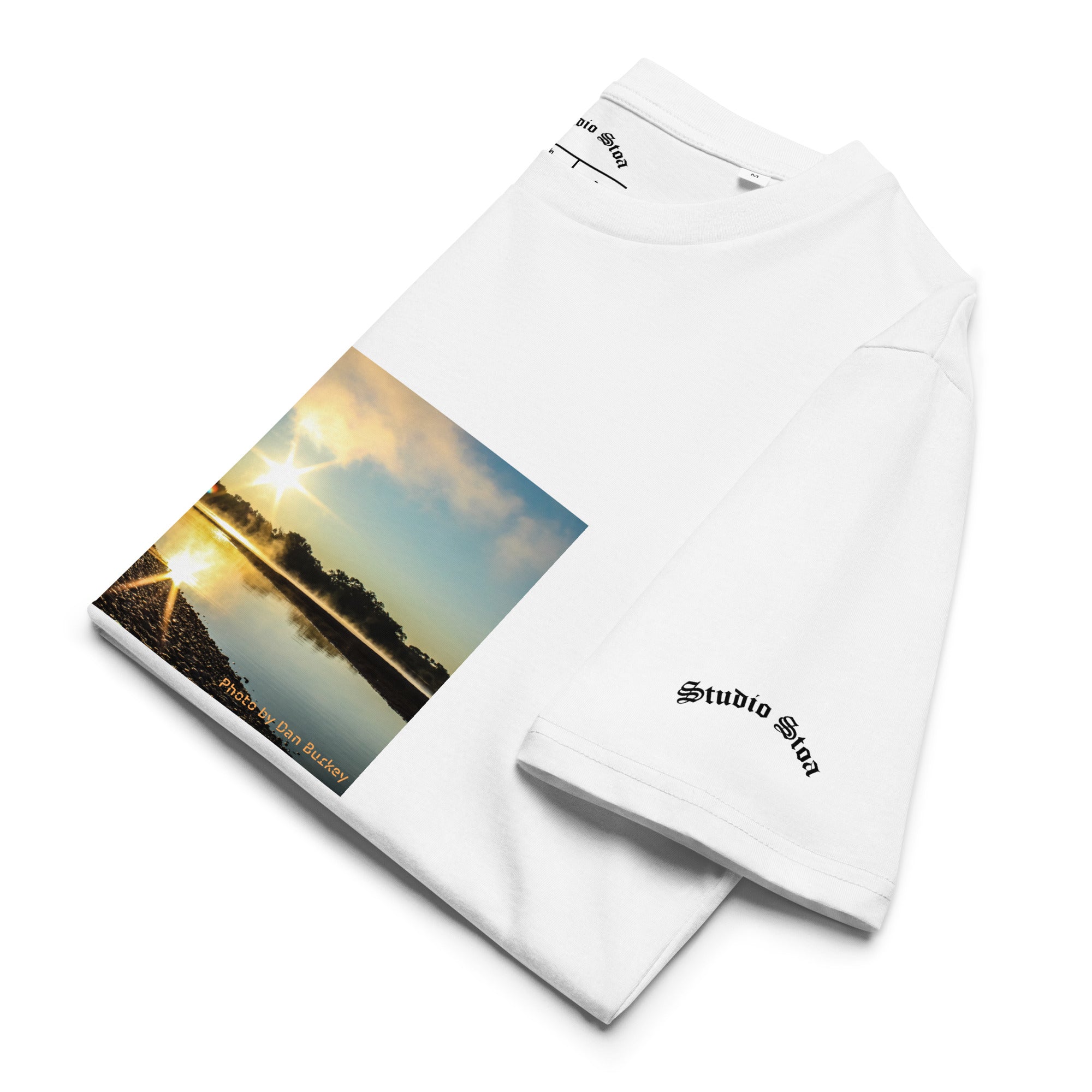 white color folded Studio Stoa theoria collection yellowstone river sunrise photo graphic tee 