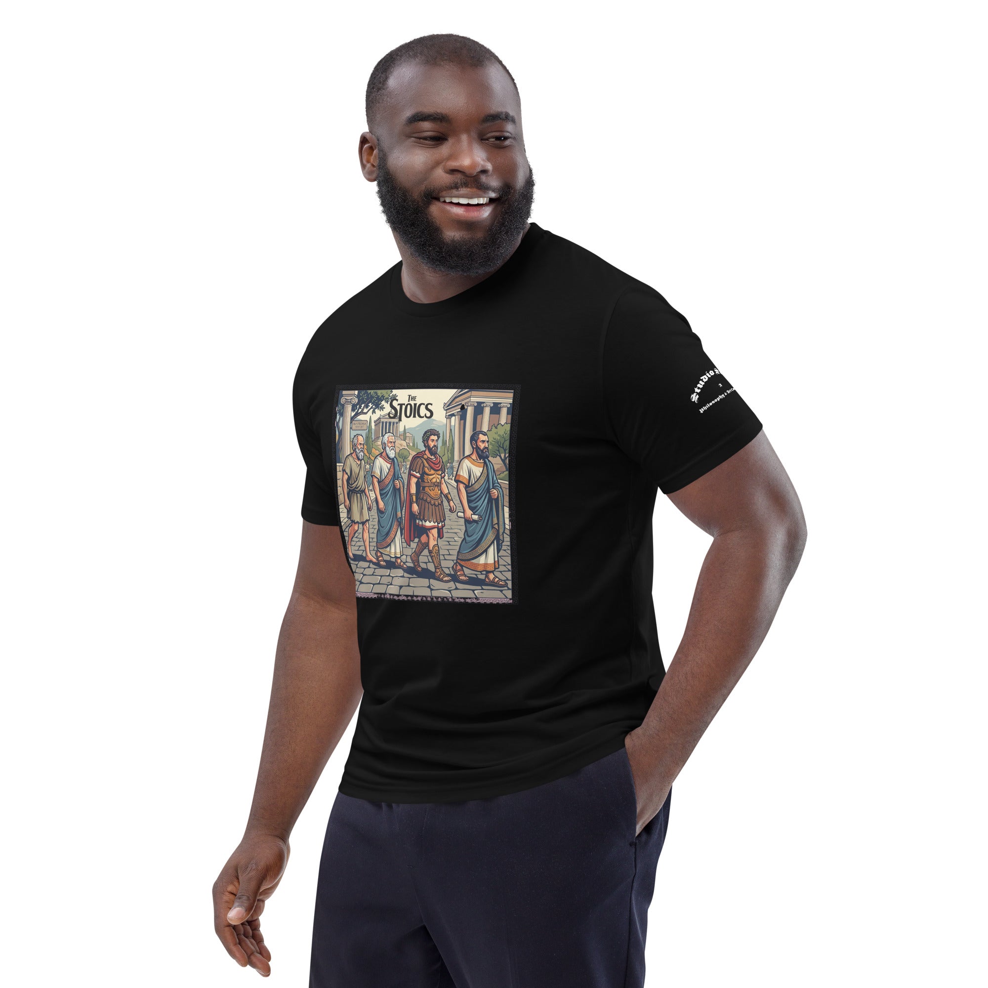 Male model wearing a black t-shirt with a graphic of ancient philosophers and 'The Stoics' text on a white background