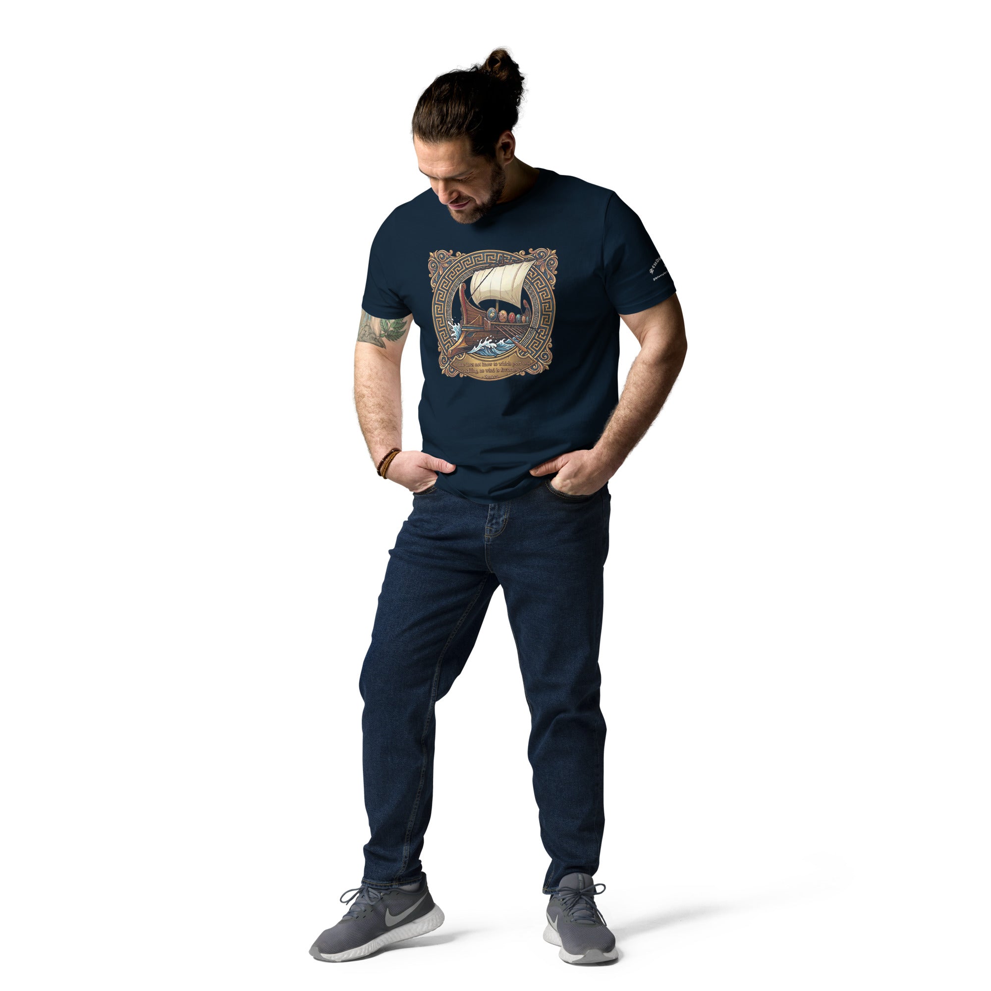 Male model wearing a navy blue tee with ship graphic and a quote from Seneca